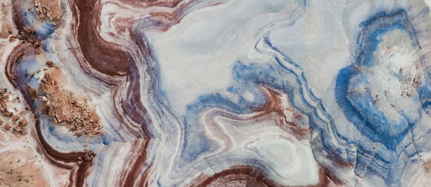 Brown, white, and blue veins in rock abstract - Photo by Karsten-Winegeart via Unsplash